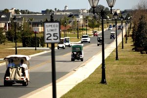 Golf carts driving on the road